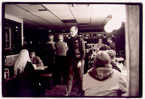 Patrons at Mr. T's in Highland Park listen to the Peek Show during the Dog Rescue Benefit Nov. 2, 2001